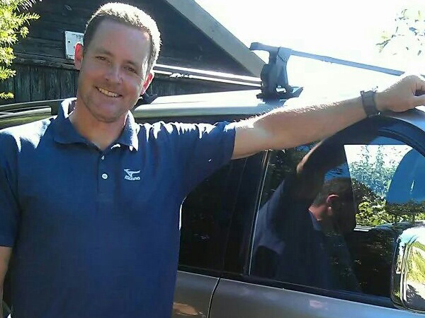 Mayn Stubley, The Chimney Chap, standing by his car